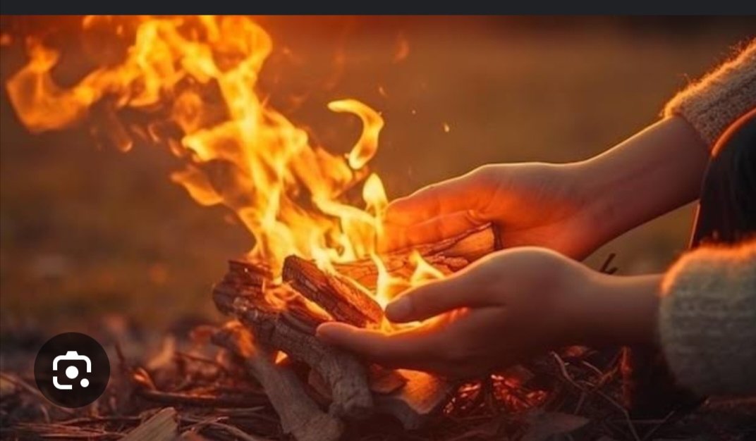 just in:: generative al depicts a person warming hand by fire due to…
